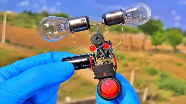 Handheld DIY hazard light LED circuit project with 12V indicator bulbs and relay close up shot.